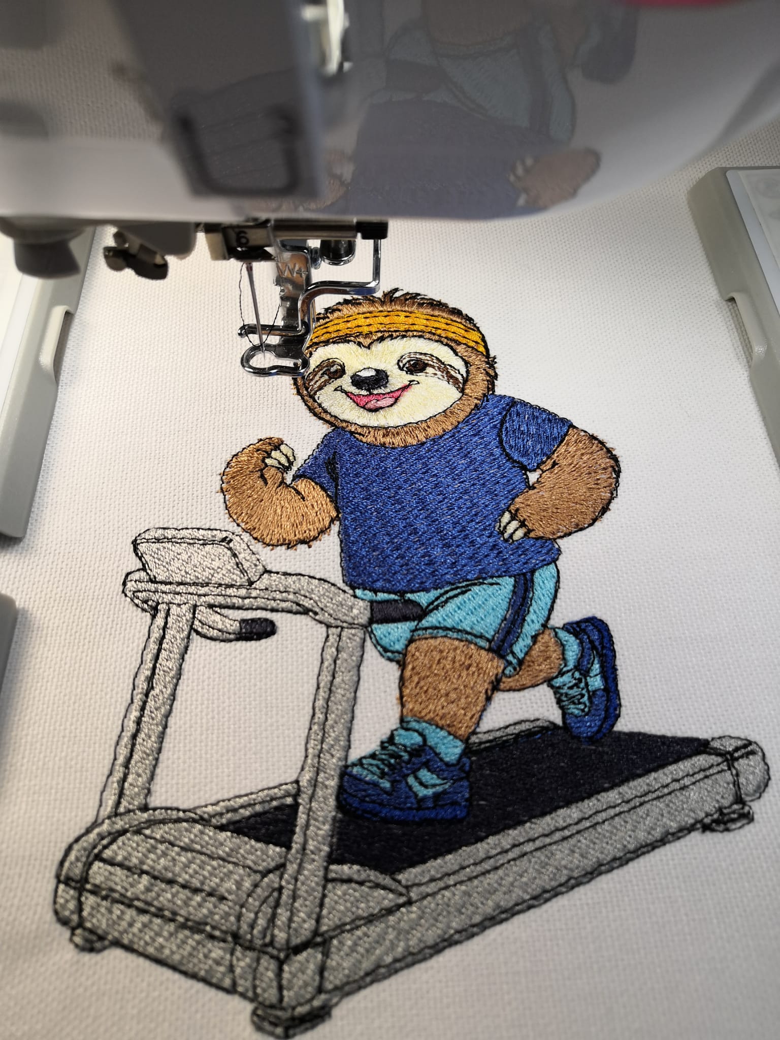 Stitched fitness sloth by Atelier RoCas on a treadmill with headband, sportswear and running shoes