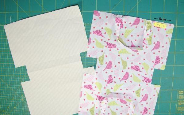 Attach handles and sew pieces together
